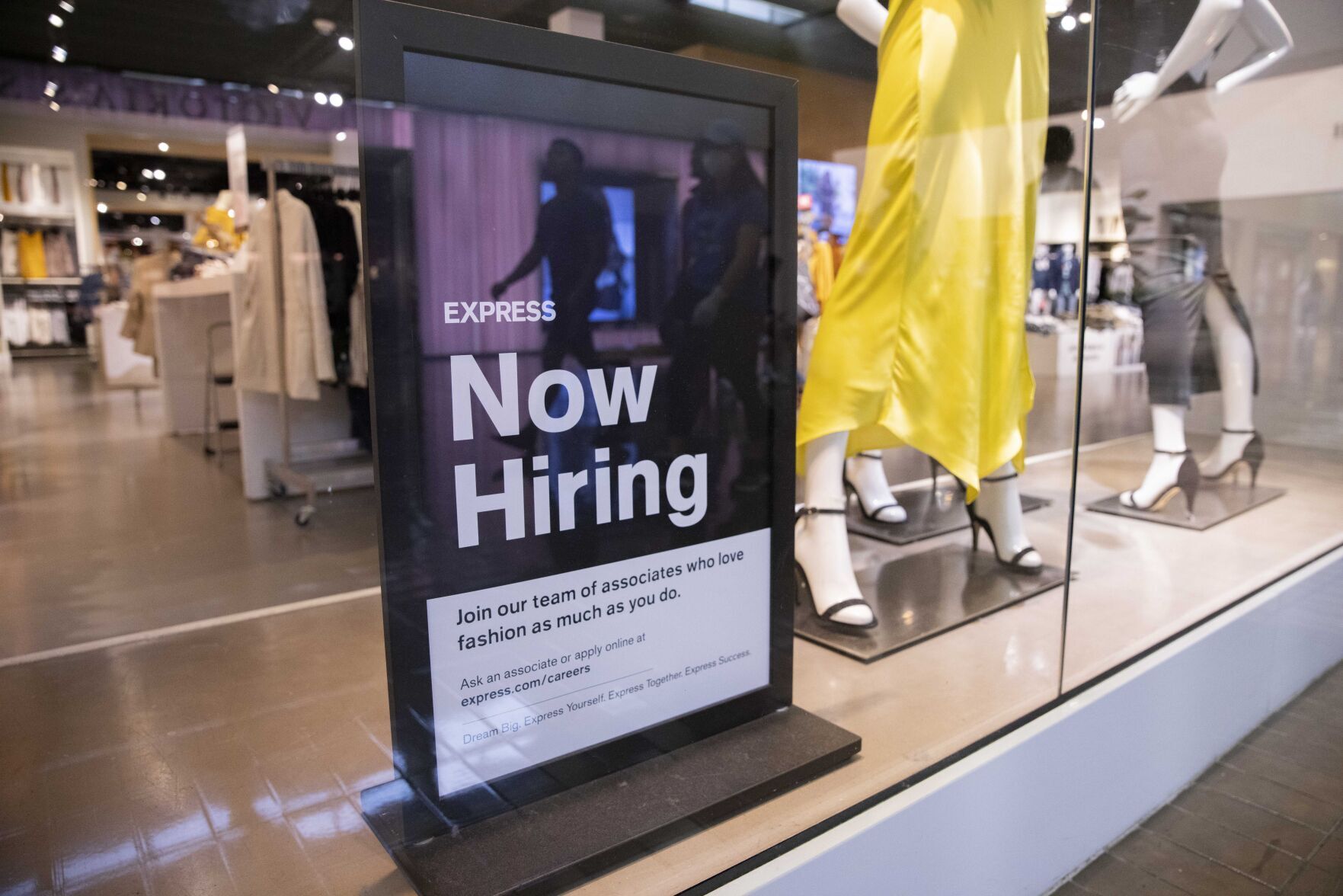 A hiring sign at Express at NorthPark Center on Friday, May 28, 2021, in Dallas.